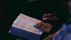 Woman reading a Bible while considering Isaiah 41 10 gifts for women
