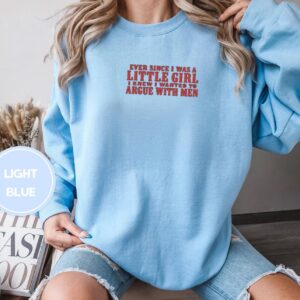 Person wearing a light blue Argue With Men Embroidered Sweatshirt