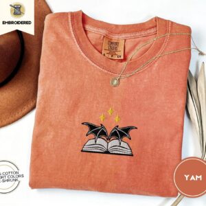 Flat lay of the Bat Wings and Book Embroidered T-Shirt