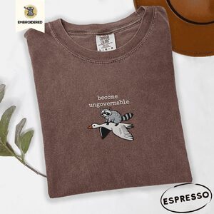 Espresso Become Ungovernable Raccoon Goose Embroidered T-Shirt