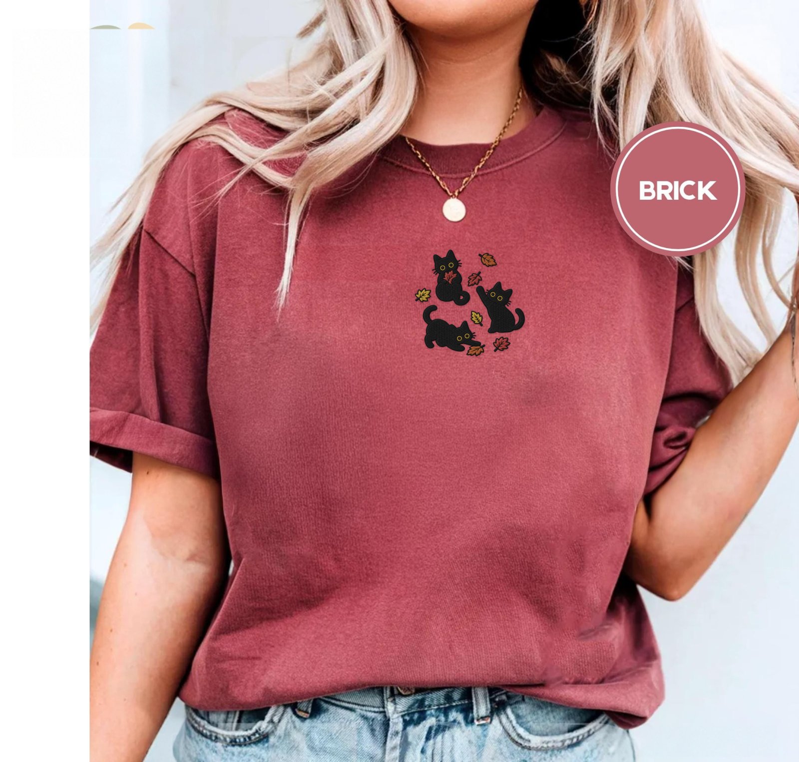 Person wearing a brick Black Cats And Fall Leaves Embroidered T-Shirt