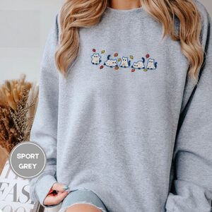 Person wearing a sport grey Blue Outlined Ghost Cat Parade Embroidered Sweatshirt