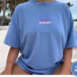 Person wearing a flo blue Book Girl Bow Embroidered T-Shirt