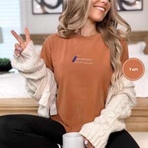 Person wearing a yam Bookmarks Are for Quitters Embroidered T-Shirt