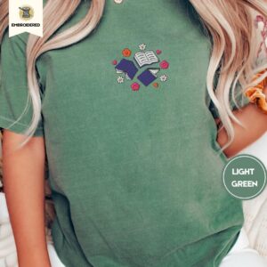 Person wearing the Books and Flowers Embroidered T-Shirt