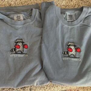Flat lay of the Boxing Raccoon Embroidered T-Shirt