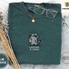 Blue Spruce Caffeine And Crime Raccoon Embroidered T-Shirt