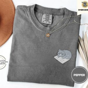 Pepper Cat on Open Book Embroidered T-Shirt