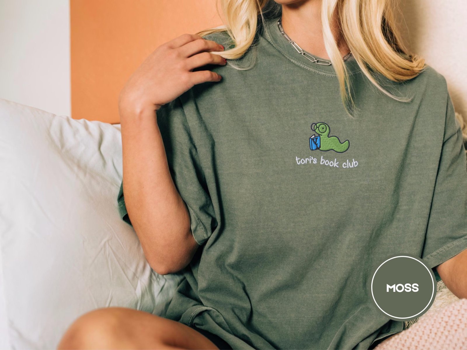 Person wearing a moss Custom Book Club Bookworm Embroidered T-Shirt