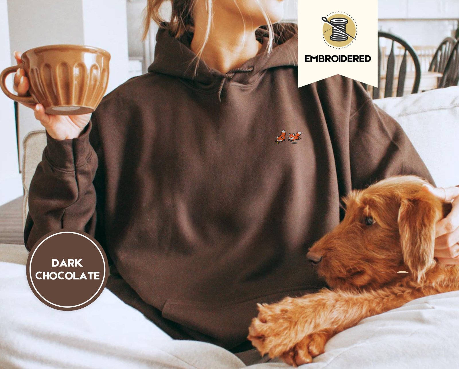 Person wearing a dark chocolate Five Playful Foxes Embroidered Hoodie