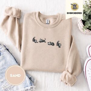 Sand Five Posing Skeleton Cats Embroidered Sweatshirt