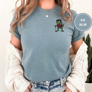 Person wearing an ice blue Golf Frog in Argyle Vest Embroidered T-Shirt