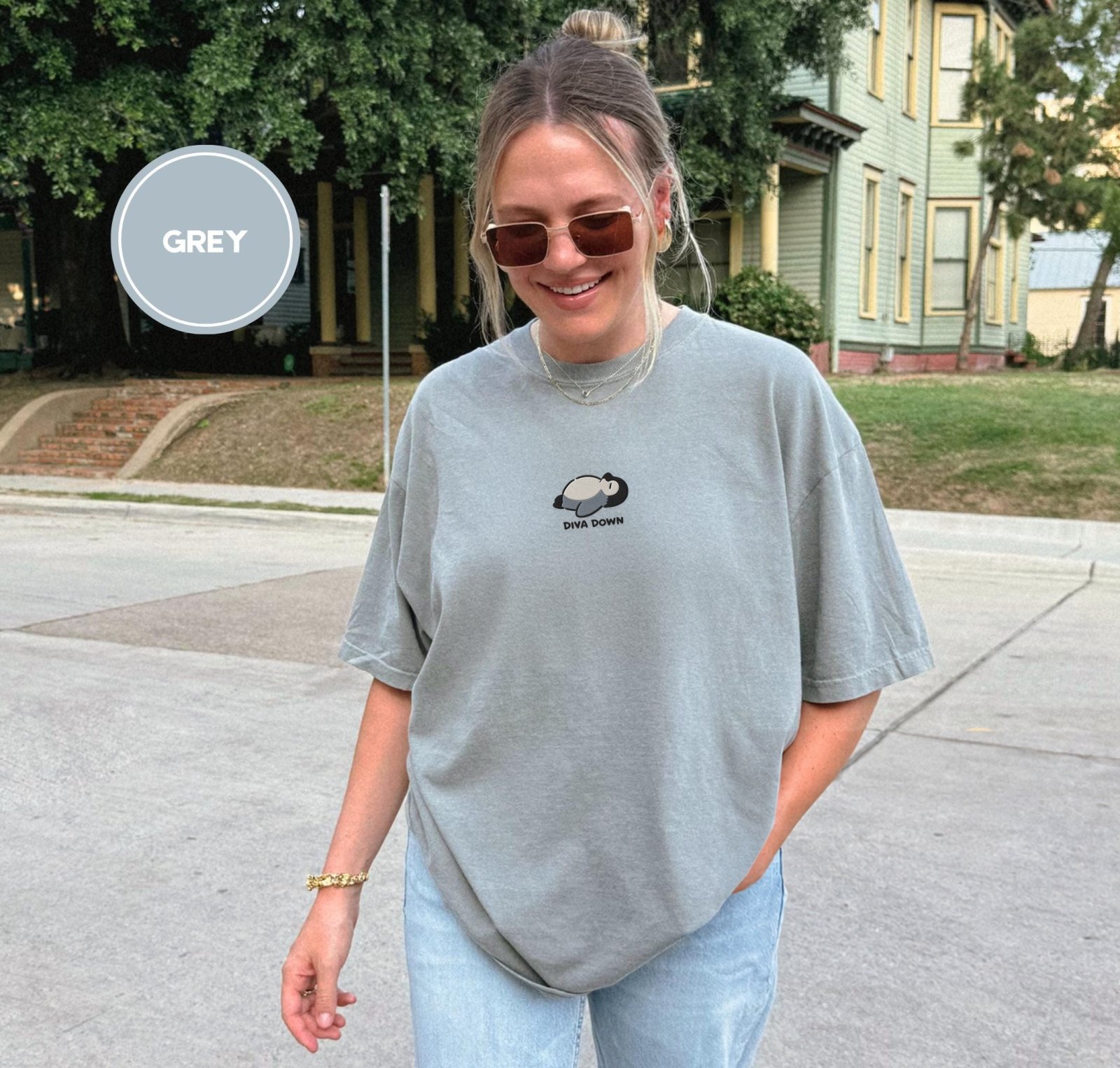 Person wearing a grey Gray Reclining Penguin Embroidered T-Shirt