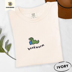 Ivory Green Bookworm With Blue Book Embroidered T-Shirt