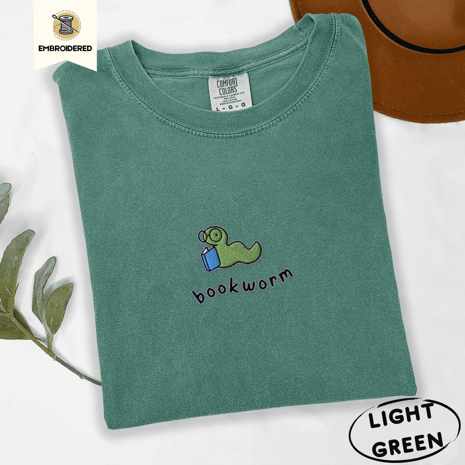 Light Green Green Bookworm With Blue Book Embroidered T-Shirt