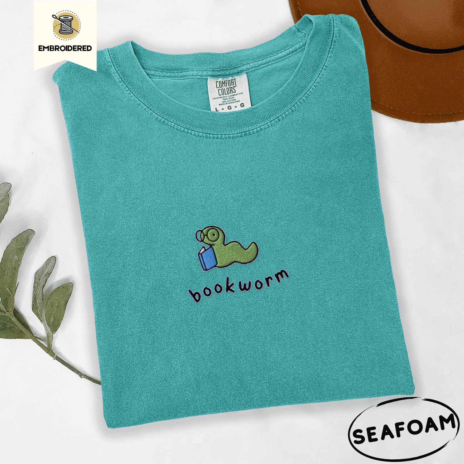 Seafoam Green Bookworm With Blue Book Embroidered T-Shirt