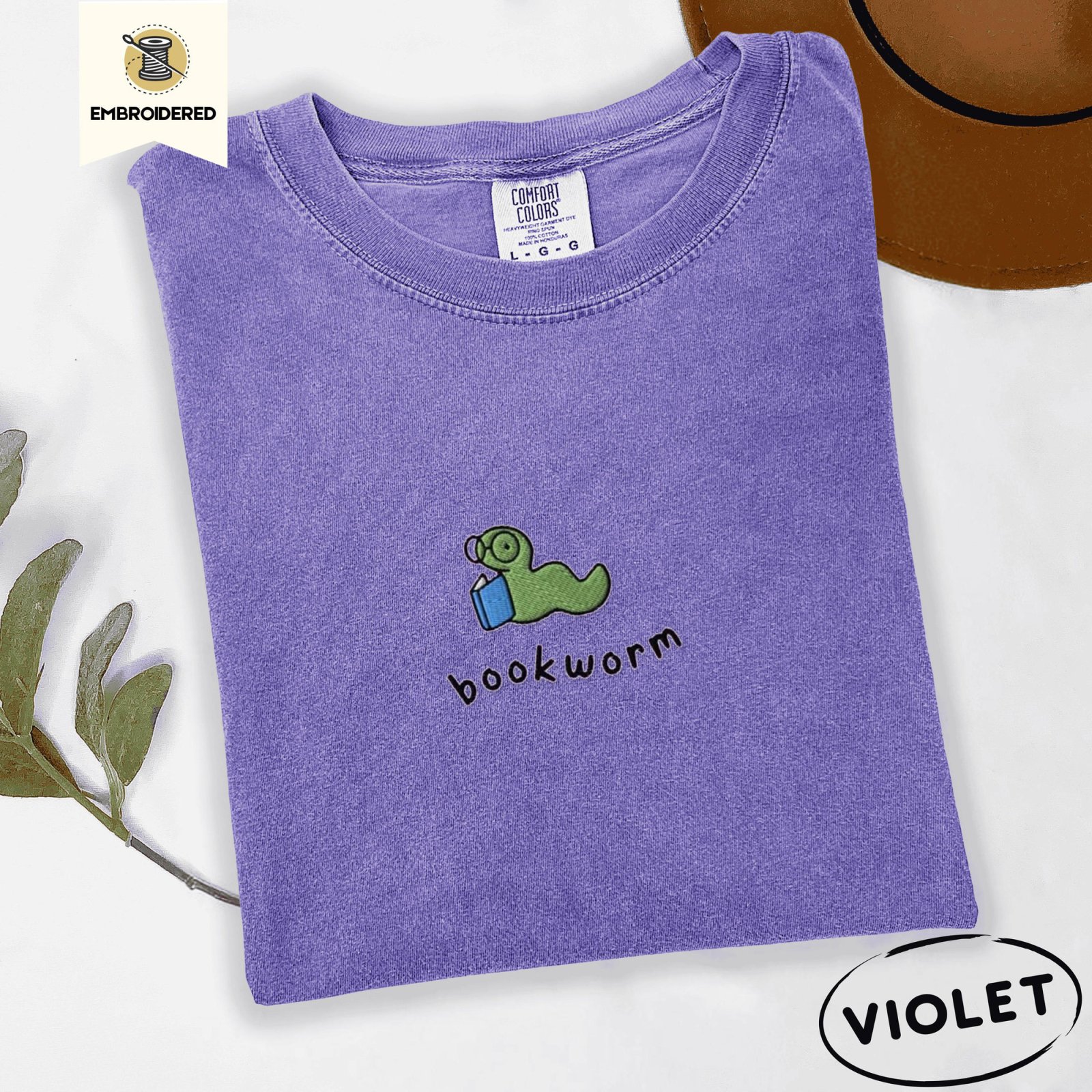 Violet Green Bookworm With Blue Book Embroidered T-Shirt