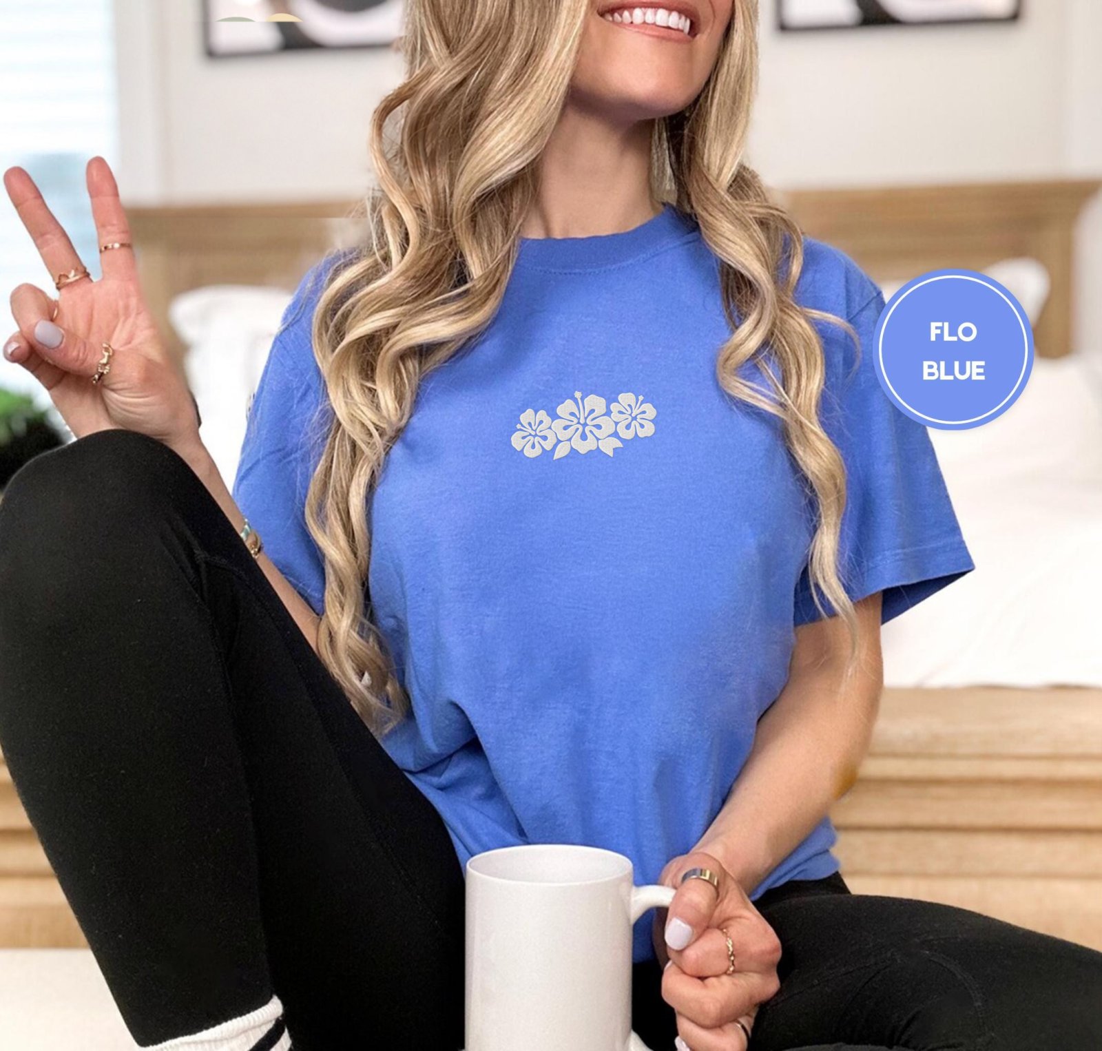 Person wearing a flo blue Hibiscus Flowers Embroidered T-Shirt