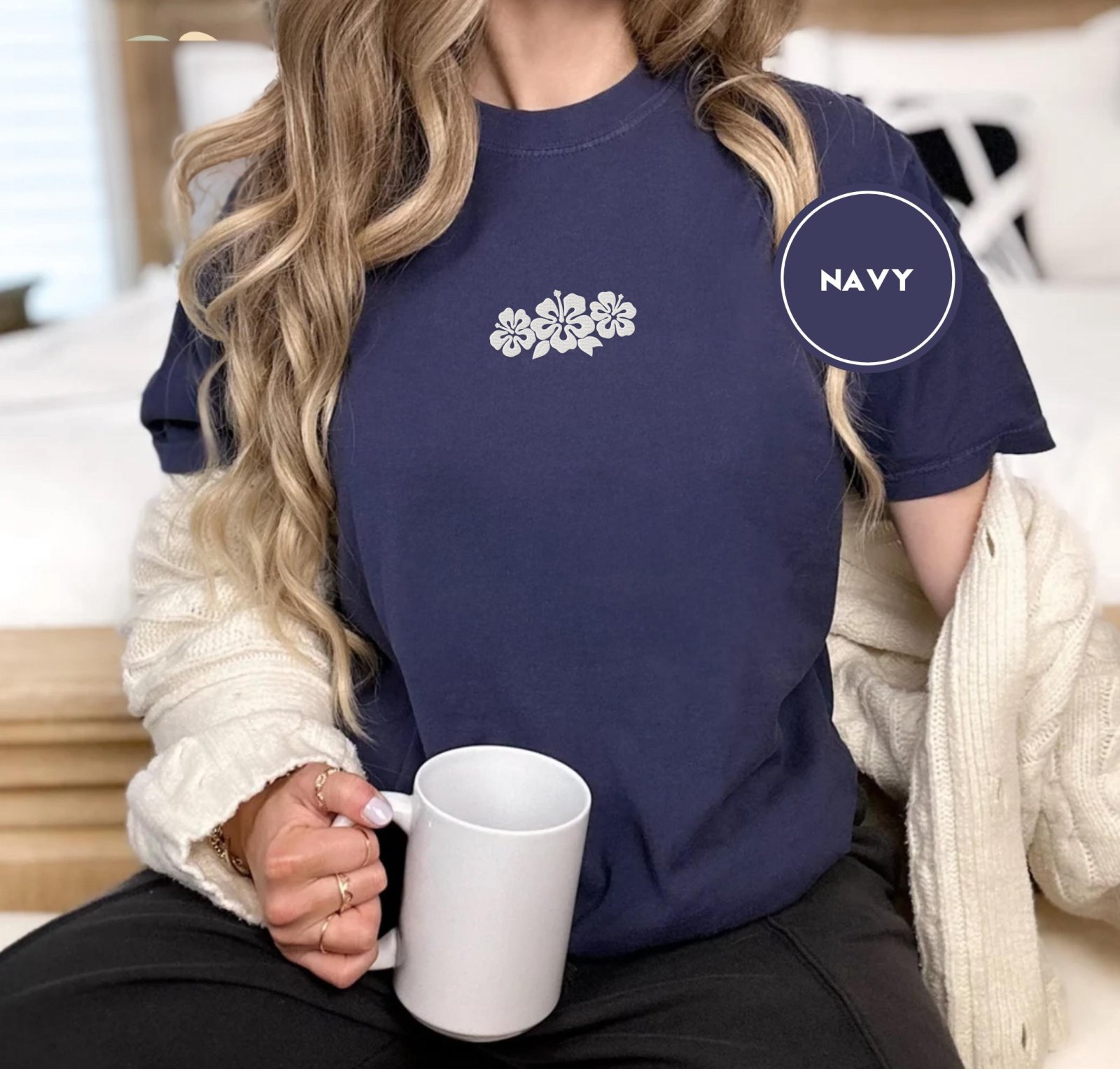 Person wearing a navy Hibiscus Flowers Embroidered T-Shirt