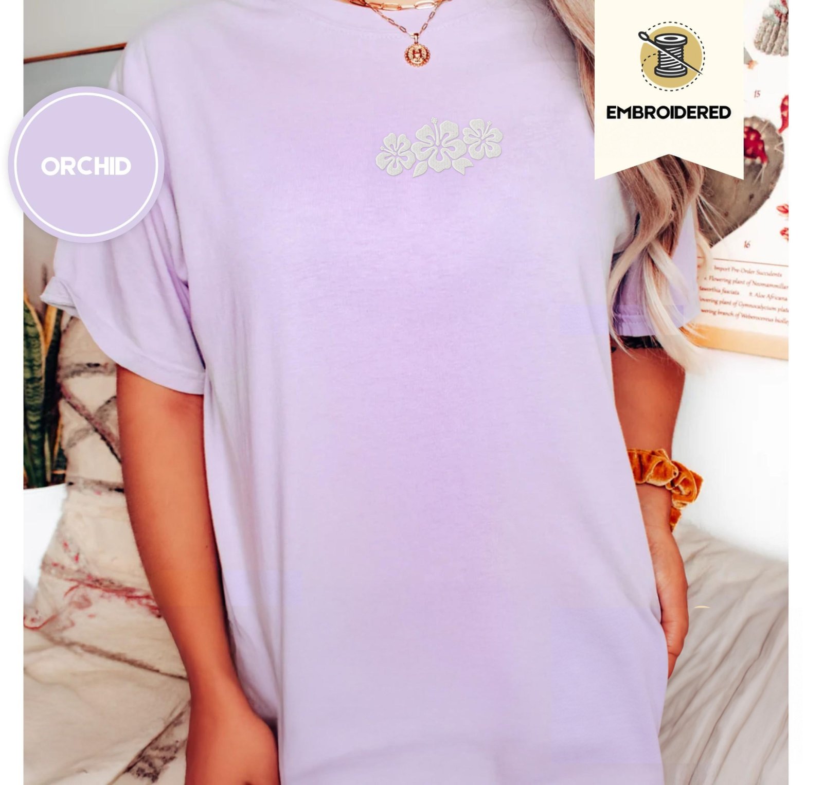 Person wearing an orchid Hibiscus Flowers Embroidered T-Shirt