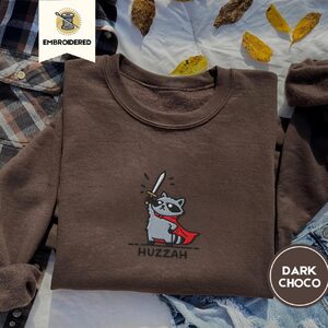 Dark Chocolate Huzzah Raccoon Knight Embroidered Sweatshirt