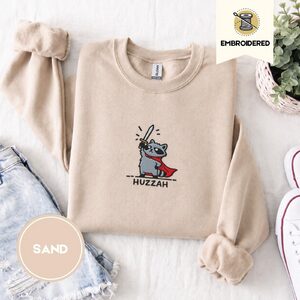 Sand Huzzah Raccoon Knight Embroidered Sweatshirt