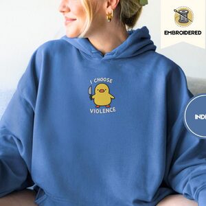 Person wearing an indigo blue I Choose Violence Duck Embroidered Hoodie