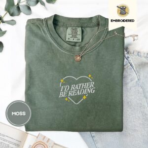 Flat lay of the I'd Rather Be Reading Embroidered T-Shirt
