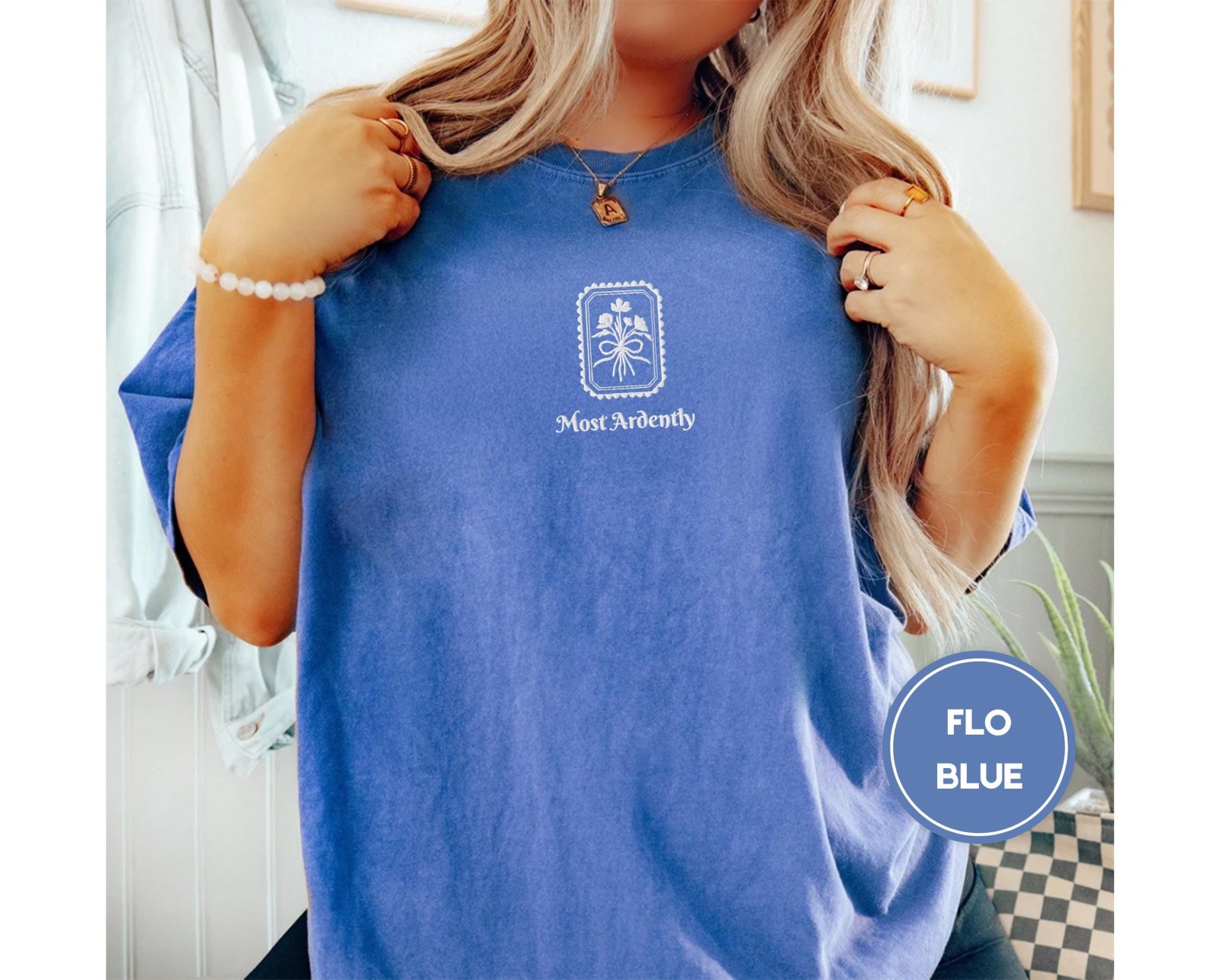 Person wearing a flo blue Most Ardently Floral Embroidered T-Shirt