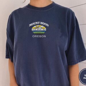 Person wearing a true navy Mount Hood Oregon Embroidered T-Shirt