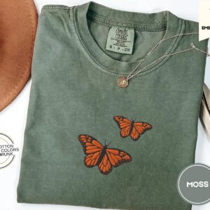 Flat lay of the Orange Butterflies Embroidered T-Shirt