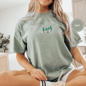 Person wearing a bay Pine Forest Ghost Duo Embroidered T-Shirt