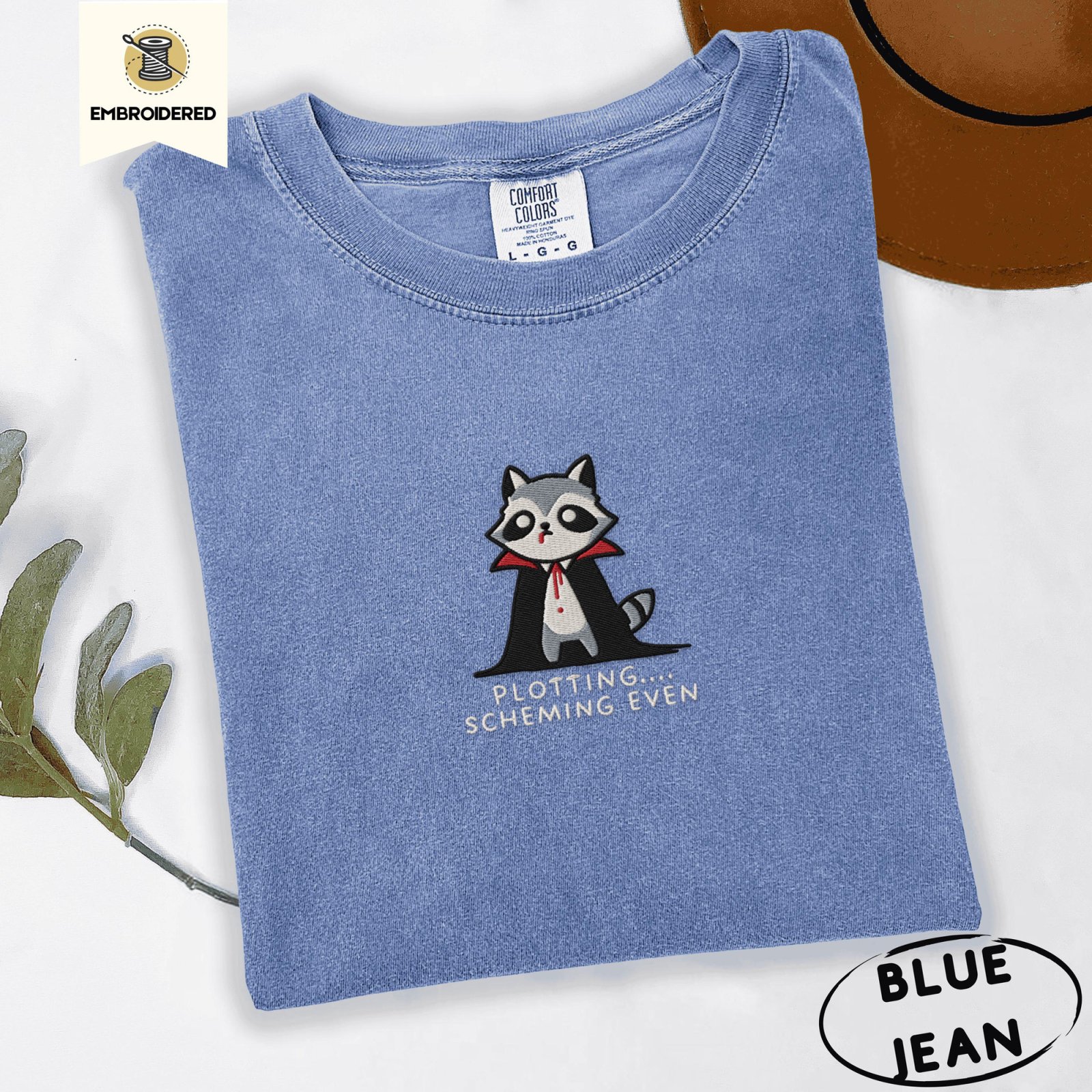 Blue Jean Plotting Scheming Vampire Raccoon Embroidered T-Shirt