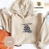 Sand Raccoon and Open Books Embroidered Hoodie