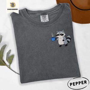 Pepper Raccoon Holding Blue Coffee Mug Embroidered T-Shirt