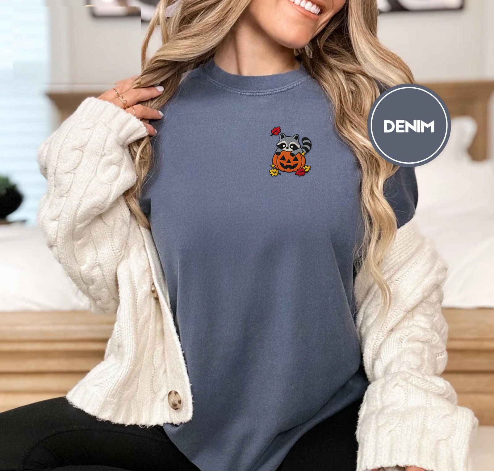 Person wearing a denim Raccoon Jack-O-Lantern Embroidered T-Shirt