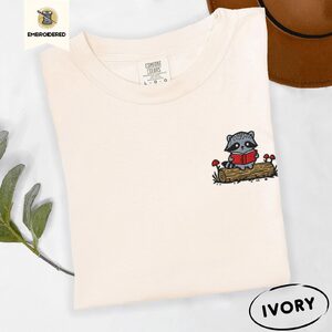 Ivory Raccoon Reading on Log Embroidered T-Shirt