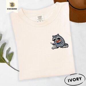 Ivory Raccoon With Books Embroidered T-Shirt