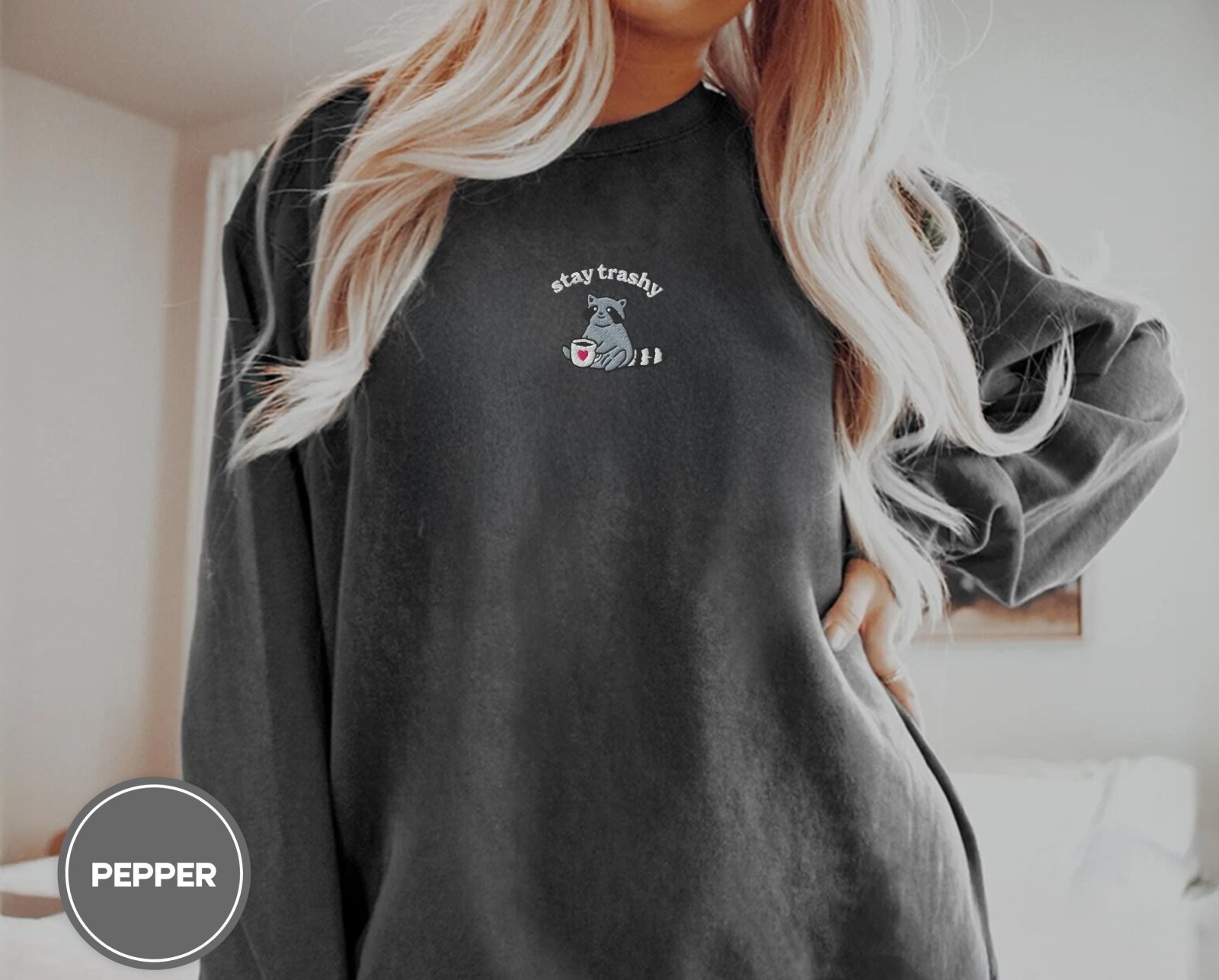 Person wearing a pepper Raccoon With Heart Mug Embroidered T-Shirt