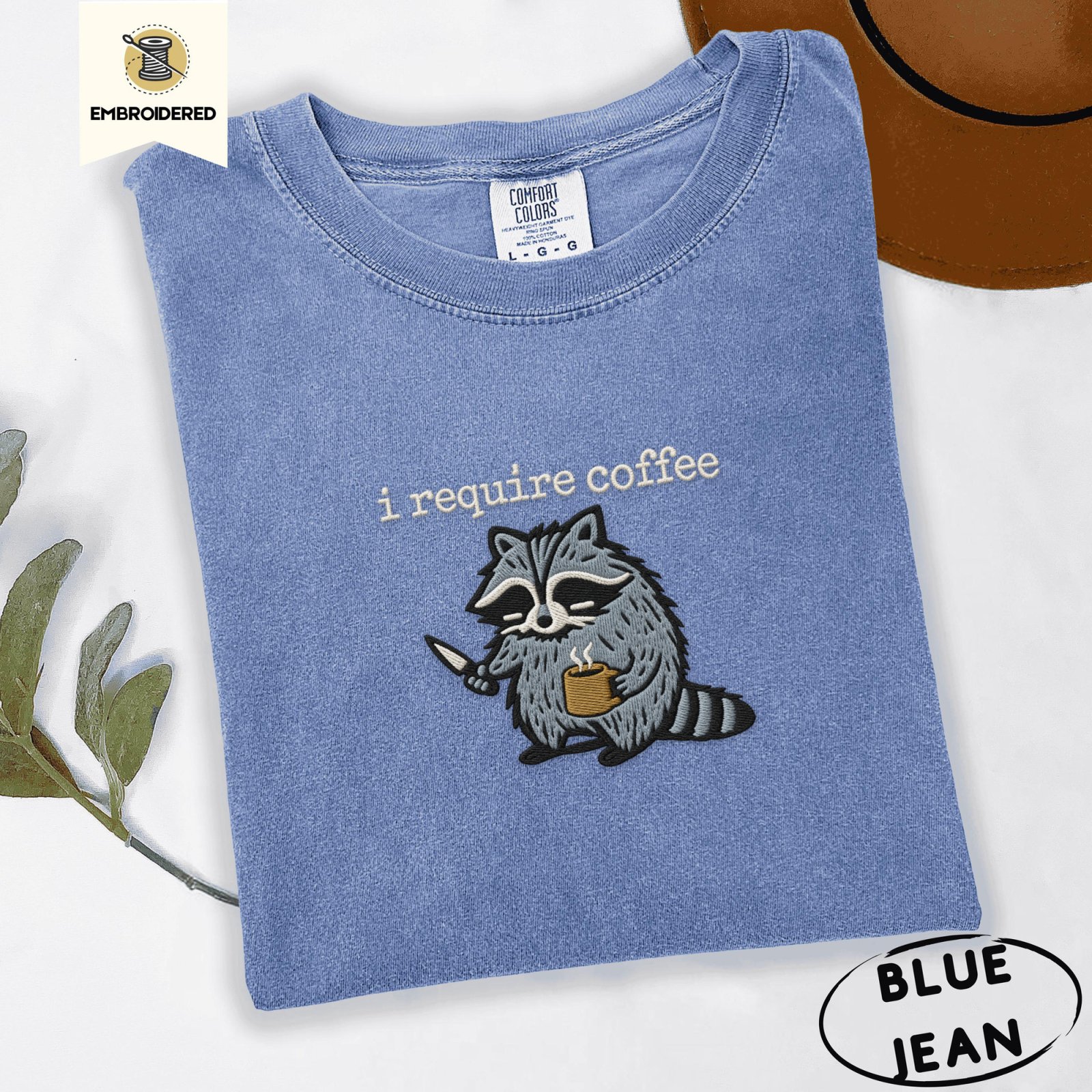 Blue Jean Raccoon With Knife and Mug Embroidered T-Shirt