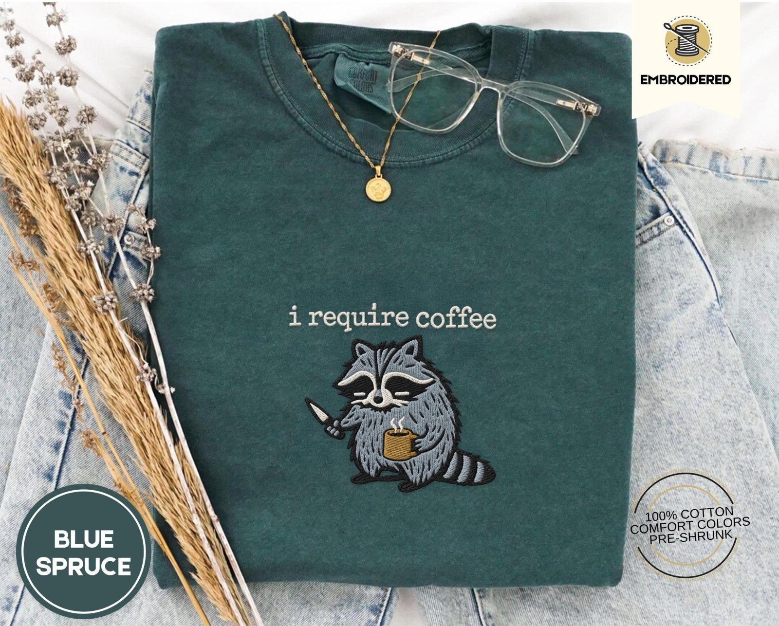Blue Spruce Raccoon With Knife and Mug Embroidered T-Shirt