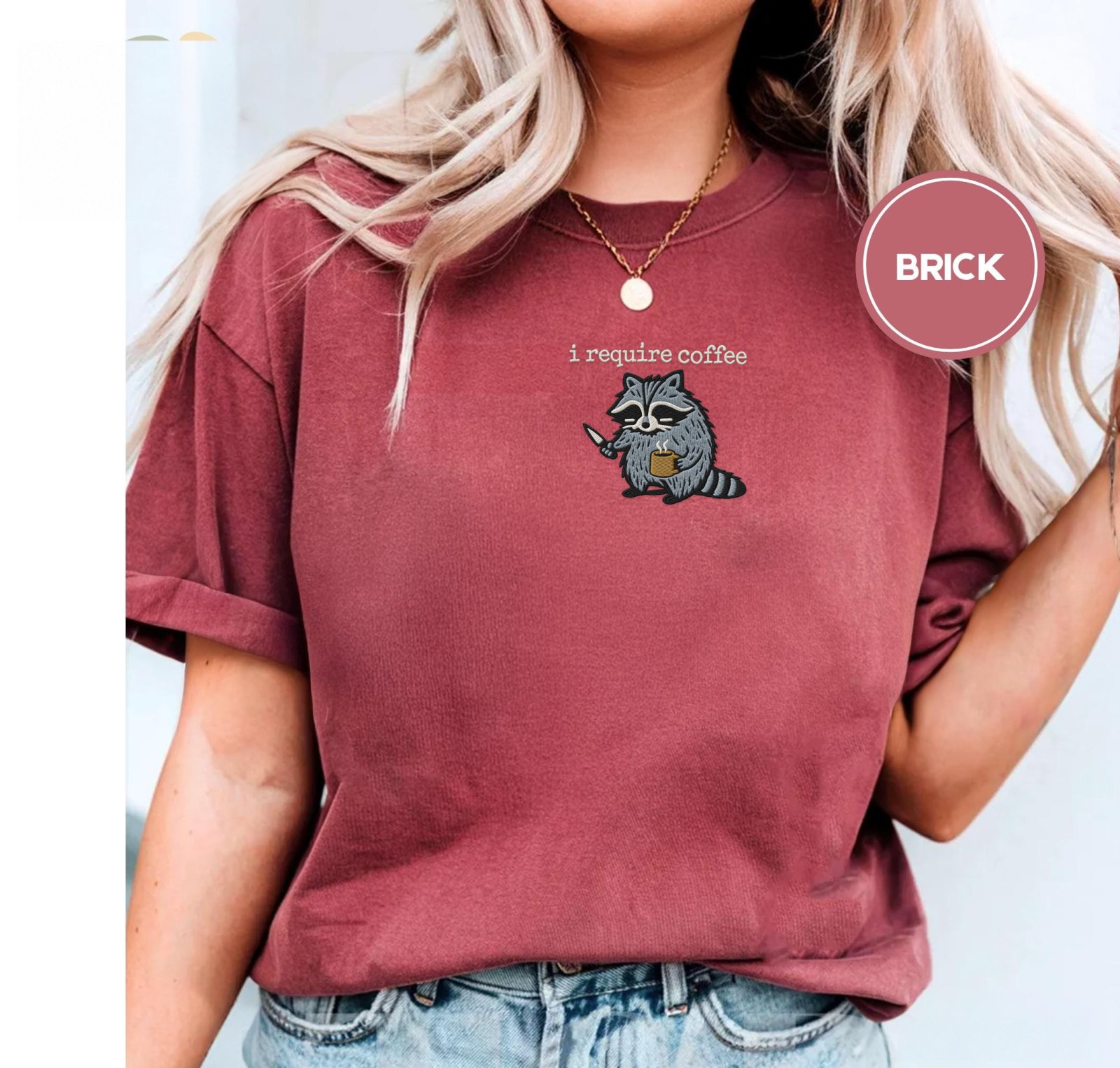 Person wearing a brick Raccoon With Knife and Mug Embroidered T-Shirt