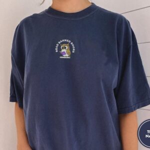 Person wearing a true navy Read Banned Books Owl Embroidered T-Shirt