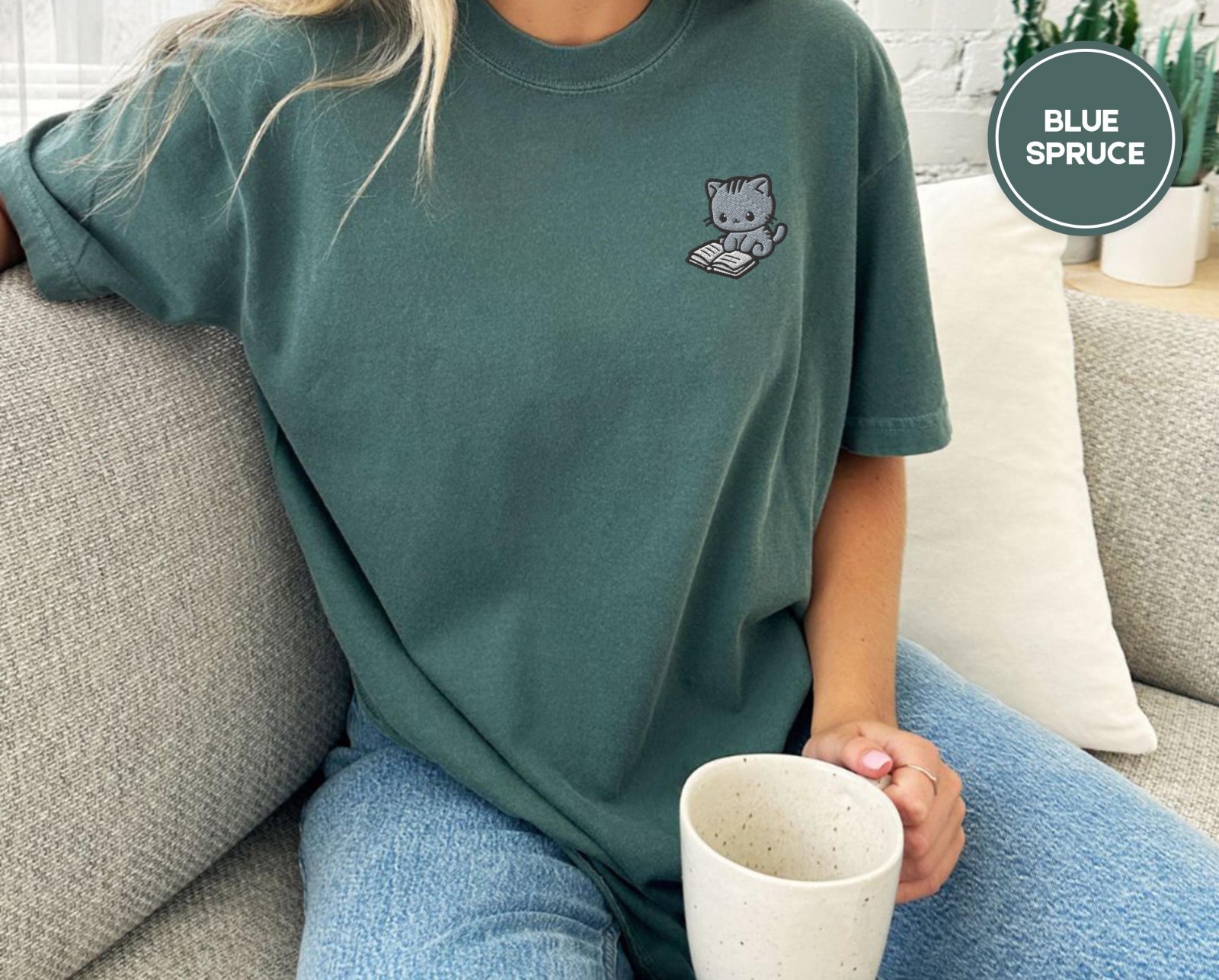 Person wearing a blue spruce Reading Cat Embroidered T-Shirt