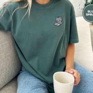Person wearing a blue spruce Reading Cat Embroidered T-Shirt