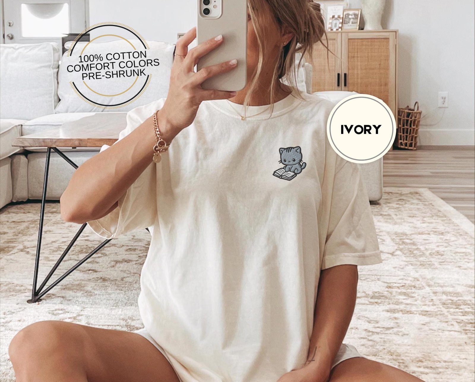 Person wearing an ivory Reading Cat Embroidered T-Shirt