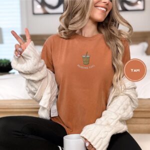 Person wearing a yam Reading Fuel Iced Coffee Embroidered T-Shirt