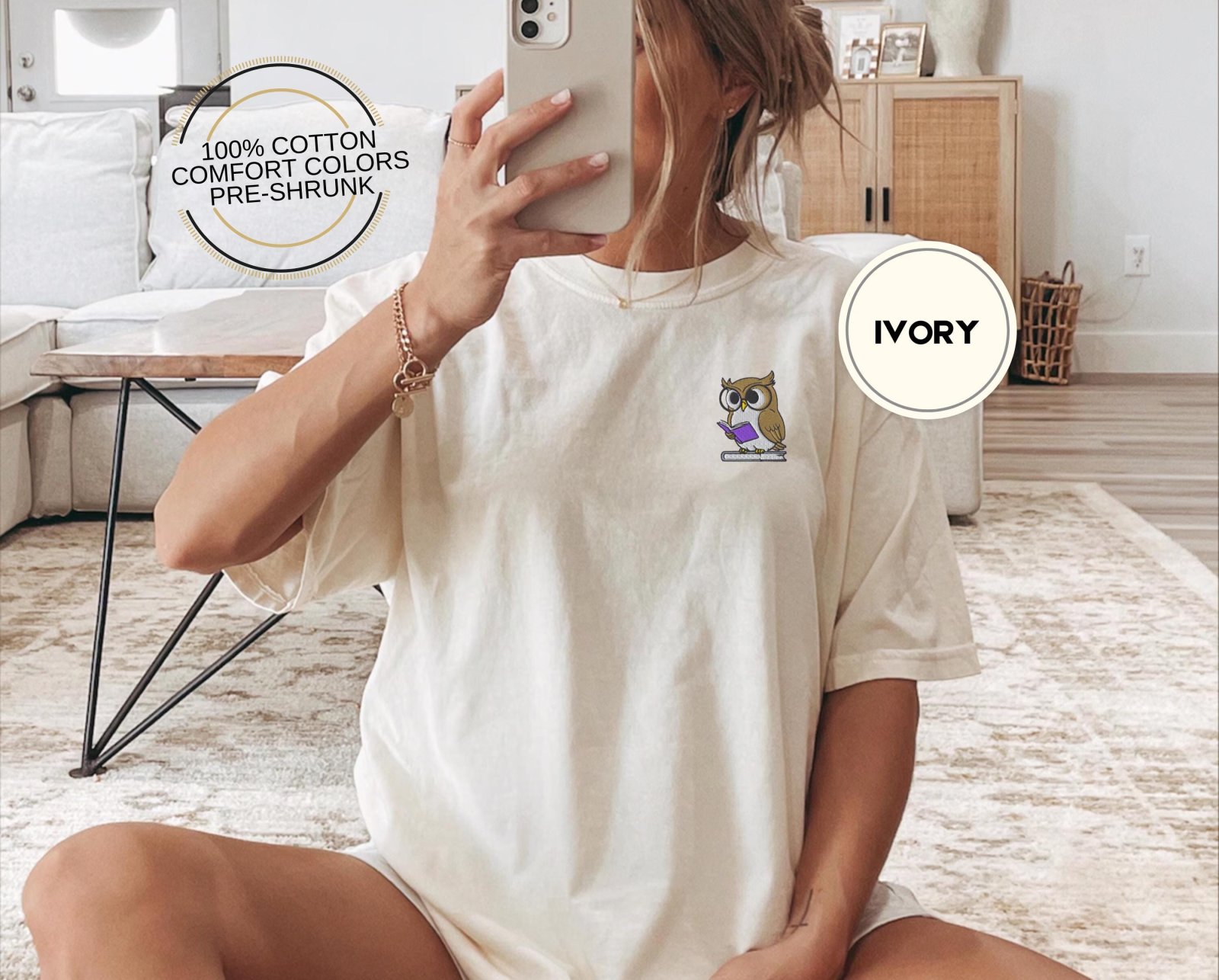 Person wearing an ivory Reading Owl Embroidered T-Shirt