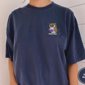 Person wearing a true navy Reading Owl Embroidered T-Shirt
