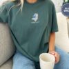 Person wearing a blue spruce Reading Polar Bear Embroidered T-Shirt